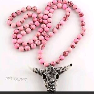 Elegant Pink Beaded Necklace with Bull Pendant